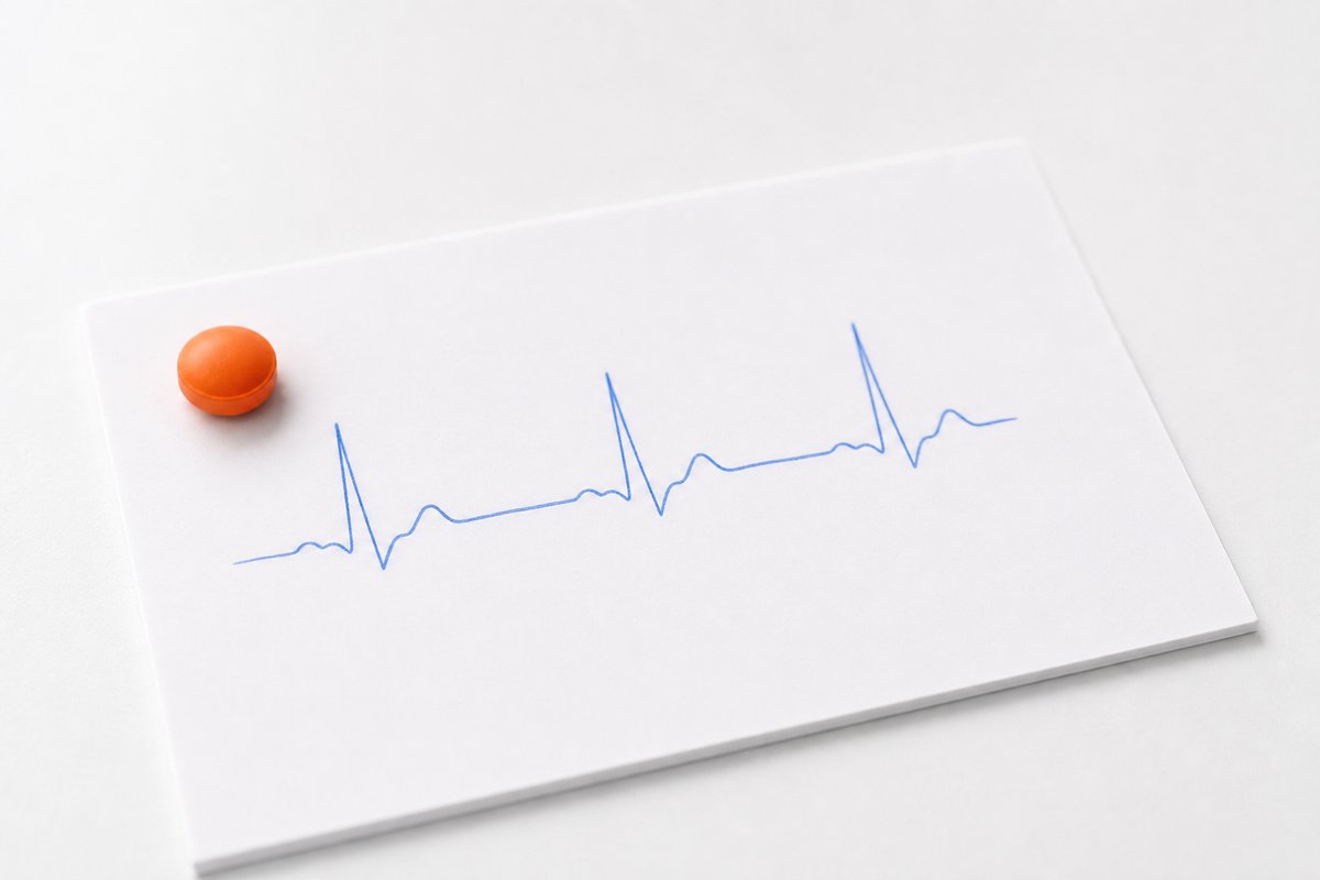 ECG line sketch beside vardenafil tablet on clinic note card